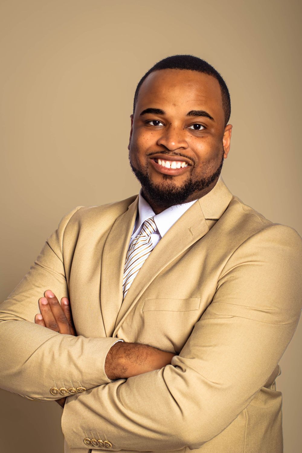 Professional portrait series showing a person in a tan suit and striped tie against a neutral background.