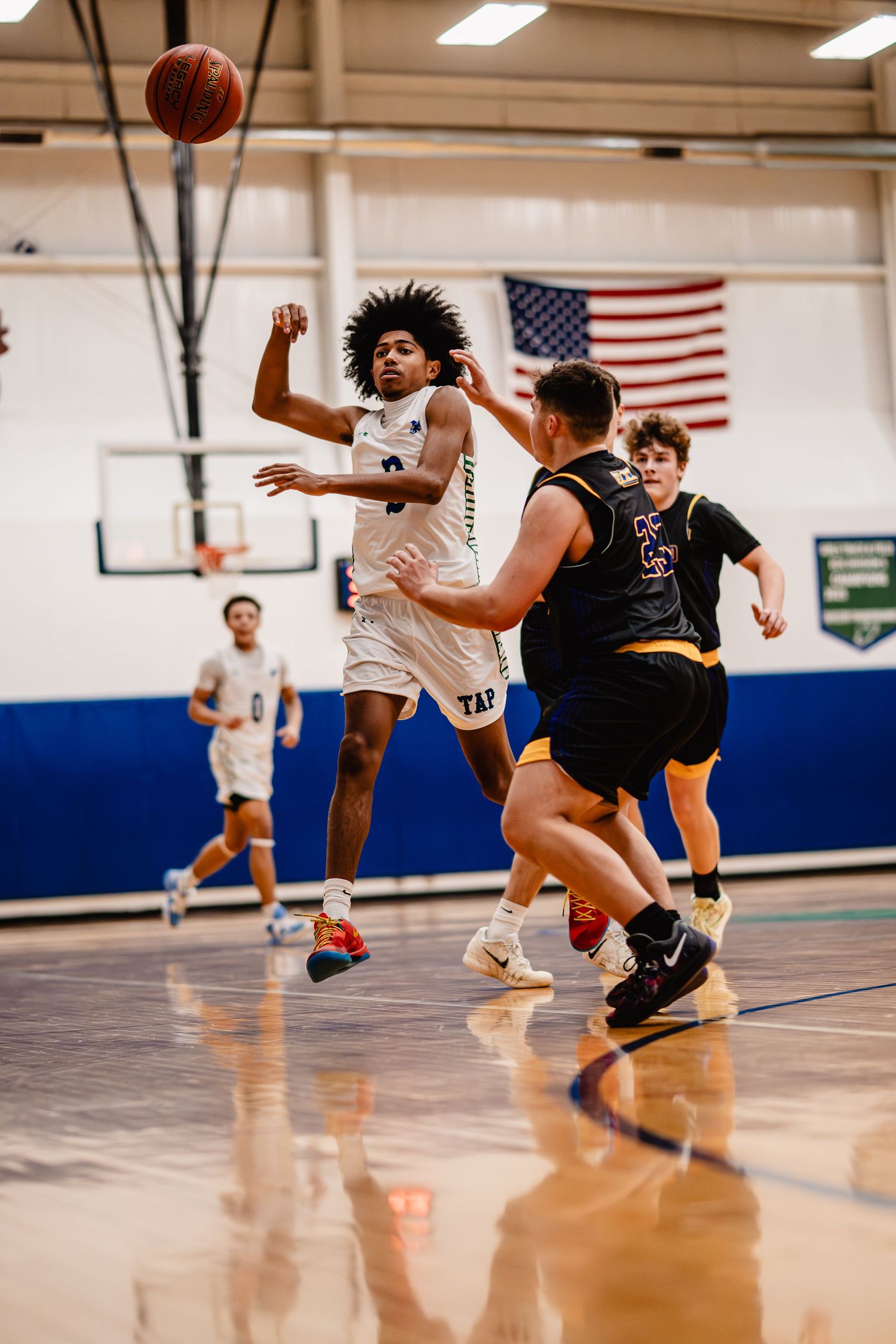 Tapestry Basketball players compete for the ball during an intense game. Buffalo ny sports photographer, forge city sports media