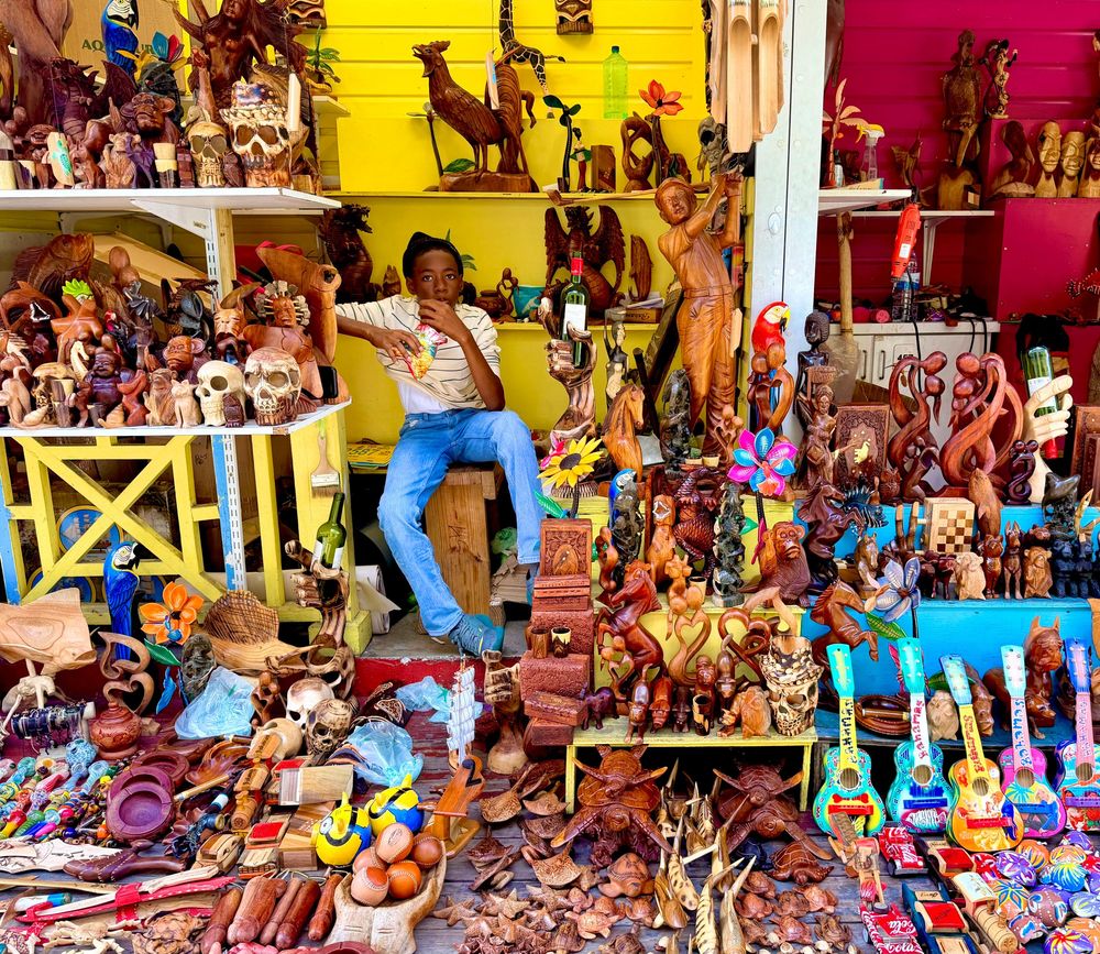 Vibrant market stall filled with traditional Mexican handicrafts and colorful folk art decorations.