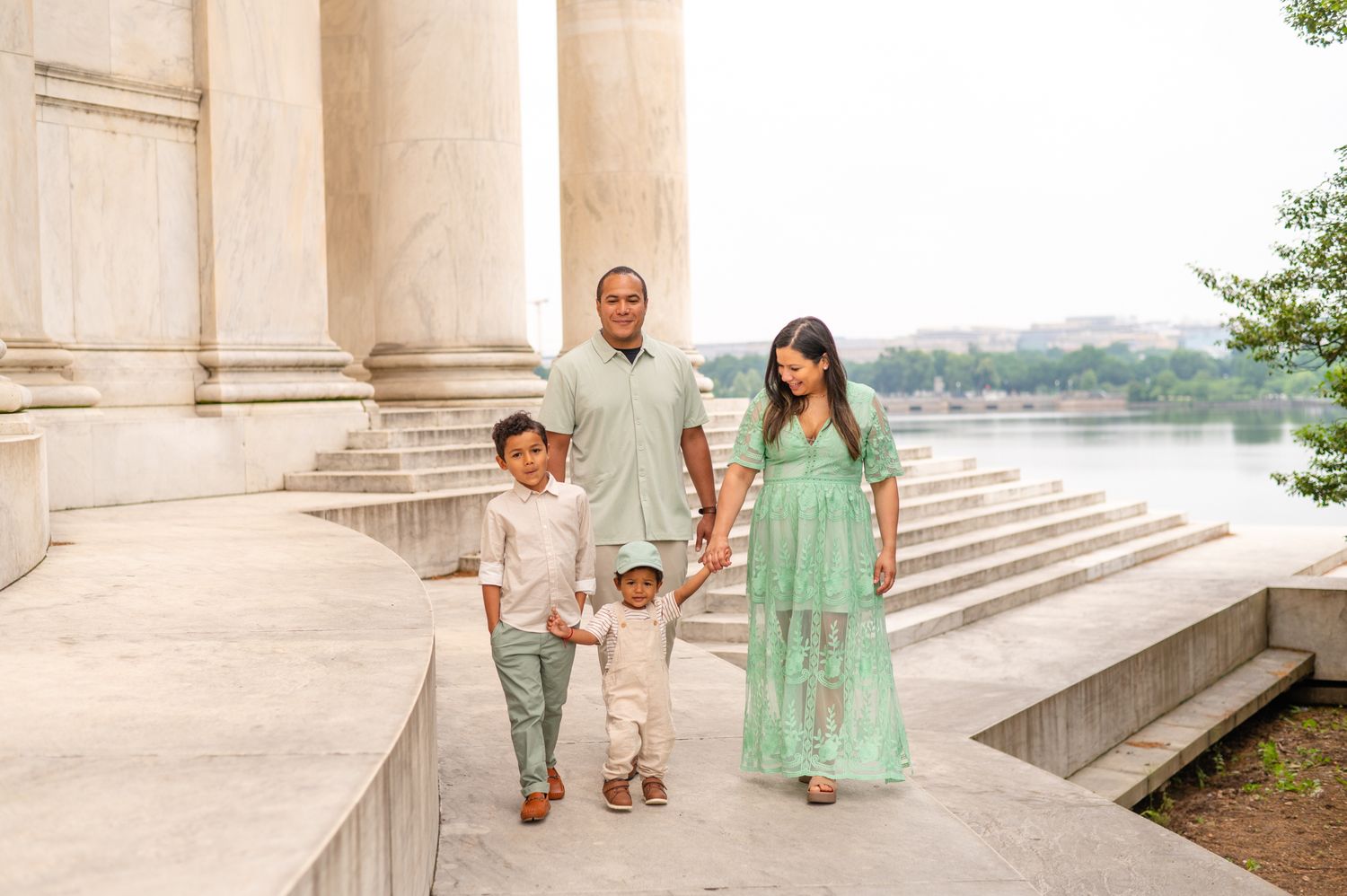 Family of four walking near the Jefferson Memorial in Washington DC, photographed by Northern Virginia family photographer Sarah Thayer