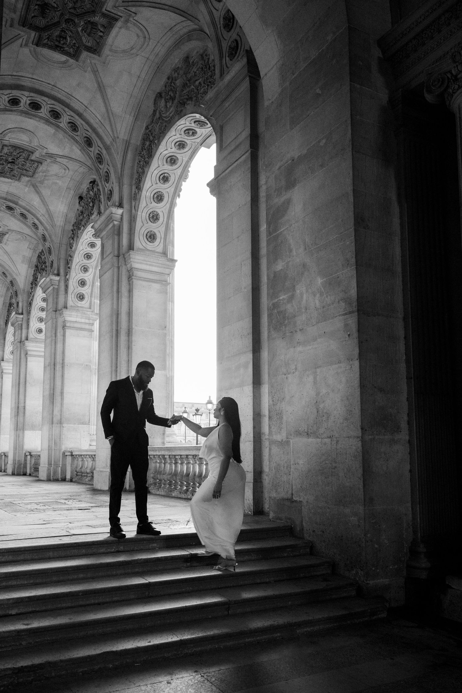 Black and white photo series showing silhouettes in an arched corridor with dramatic lighting and architectural details.