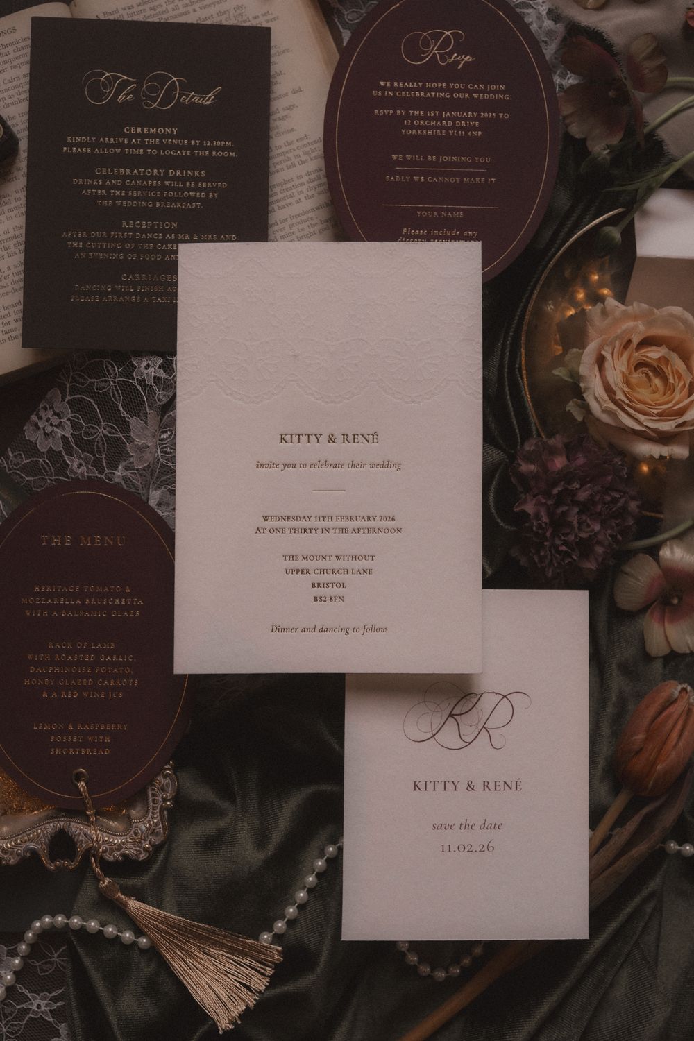 Elegant wedding invitation suite with dark brown and cream colored cards featuring calligraphy and floral details.