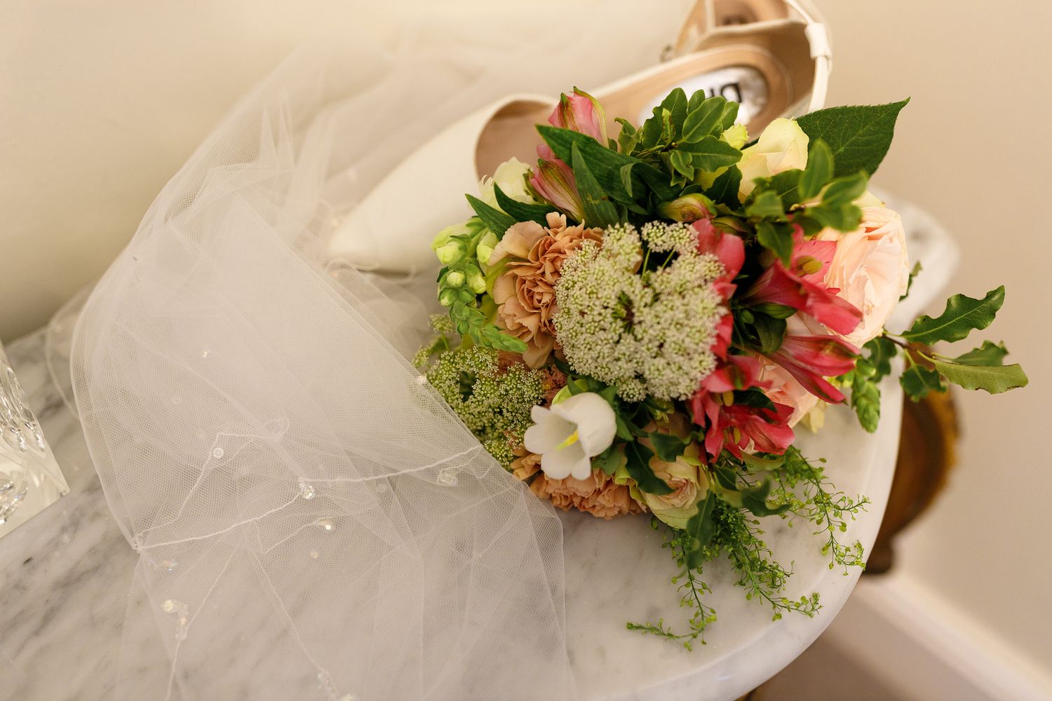 Series of elegant floral bouquets with pink and white flowers arranged on a light beige background.