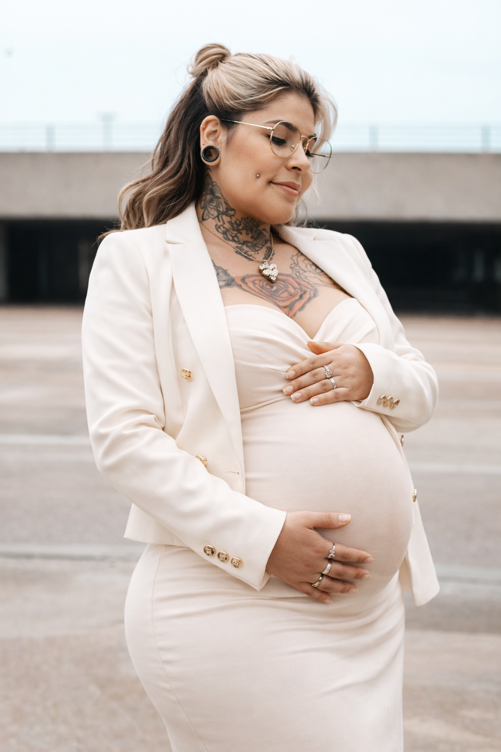 A collection of maternity portraits featuring a woman in glasses wearing an elegant white outfit against a light background.