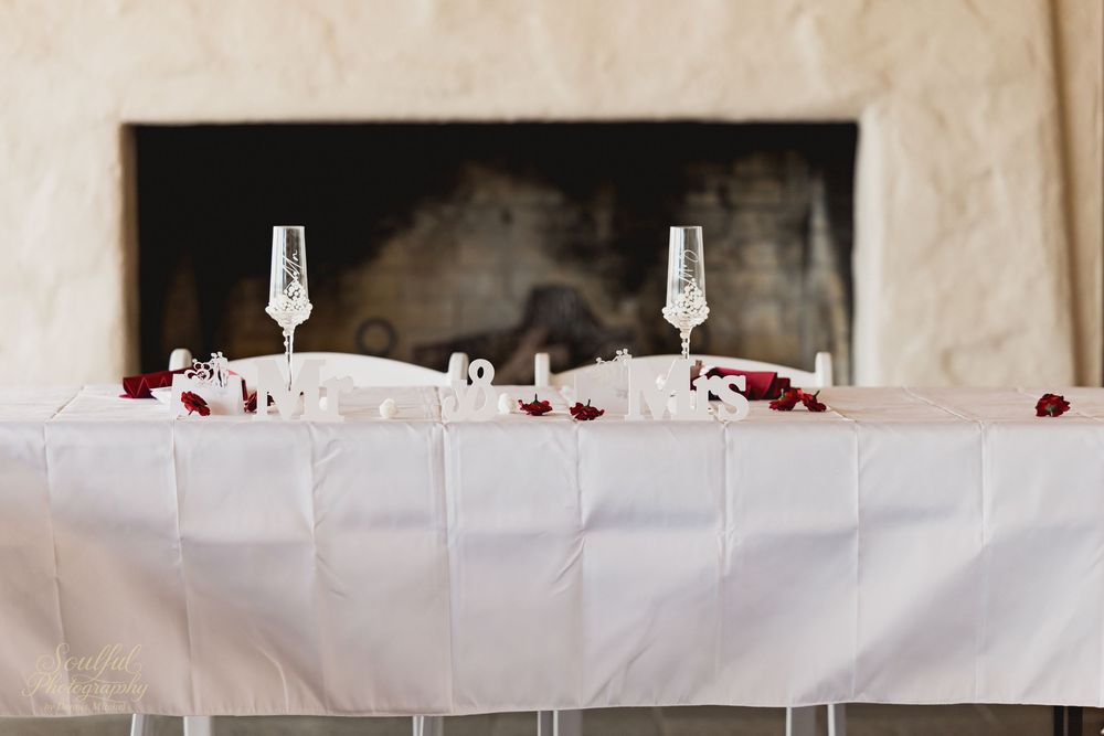 White table settings and decor at an elegant wedding reception.