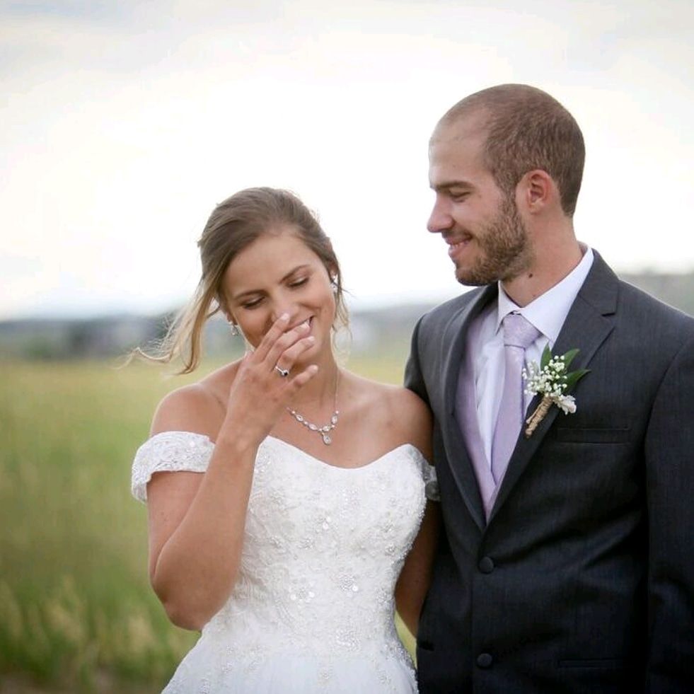 Newlyweds smiling and giggling.