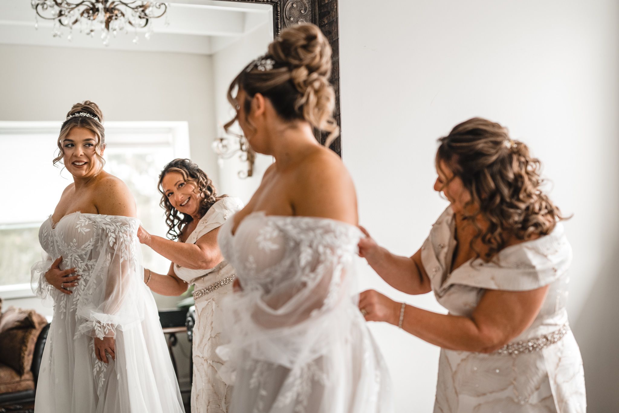 Group of people in white outfits getting ready for a special occasion.