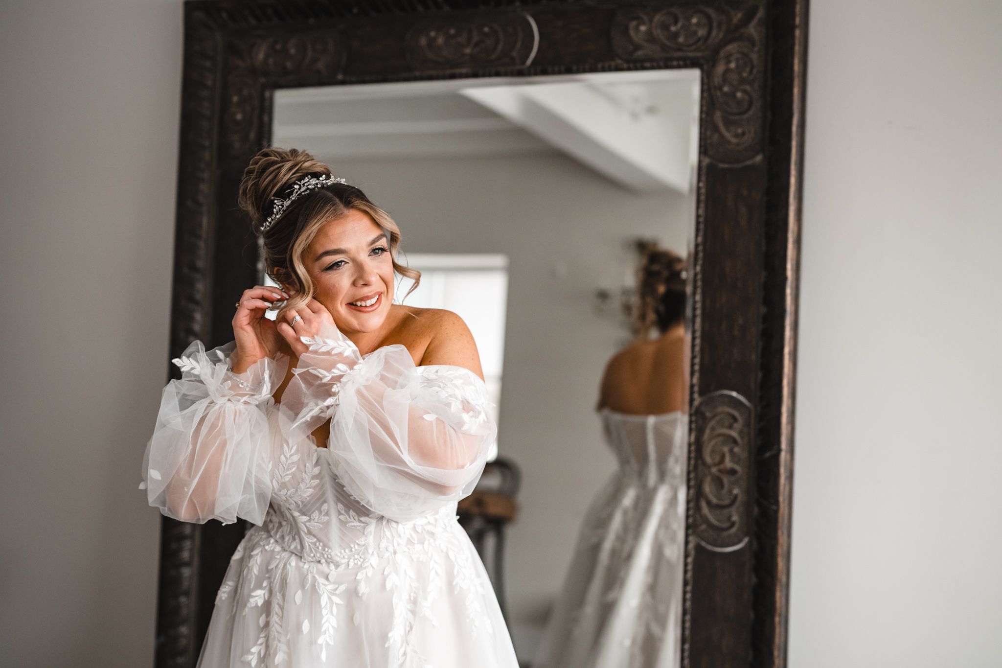 Joyful pre-wedding moments shared between friends in a bright dressing room.