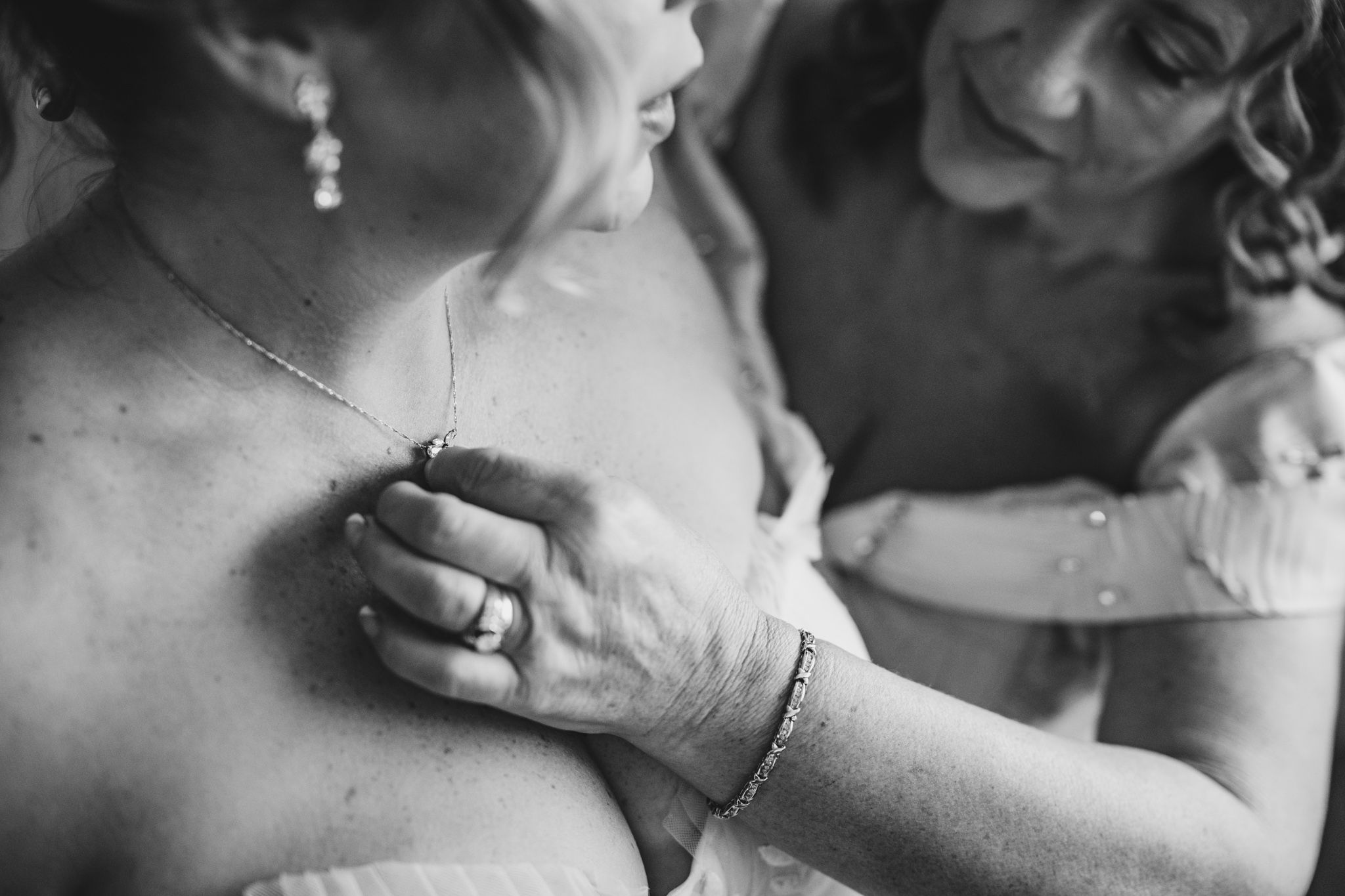 Intimate black and white candid moments during wedding preparations.