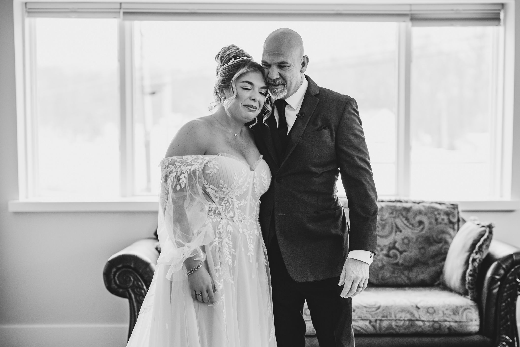 Sunlit wedding venue features classic decor and large windows.