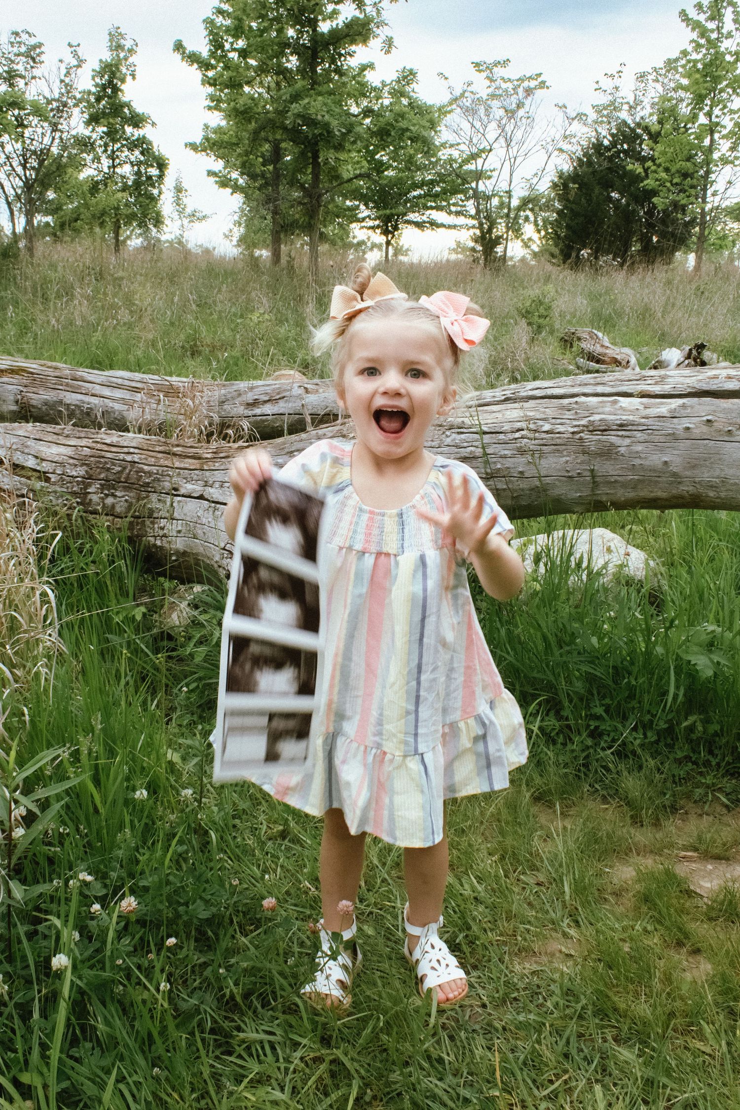 a little girl excited to become a big sister