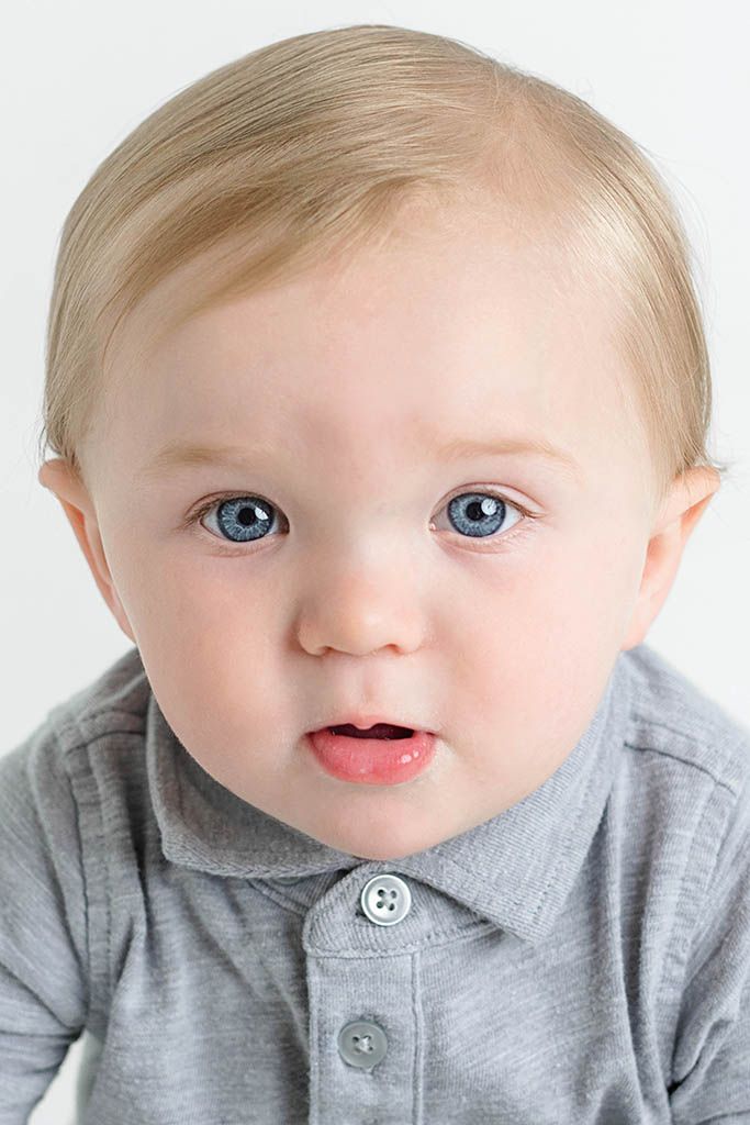 Portrait of adorable blue-eyed baby with blonde hair by professional photographer near Wildomar, California.