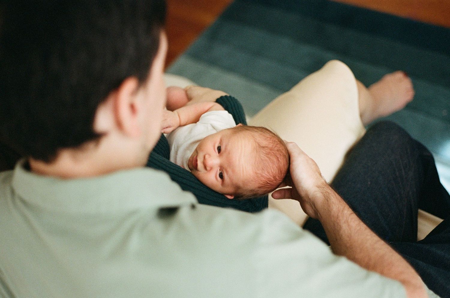 newborn photography session on film in New York City with soft natural light and intimate, emotional connection