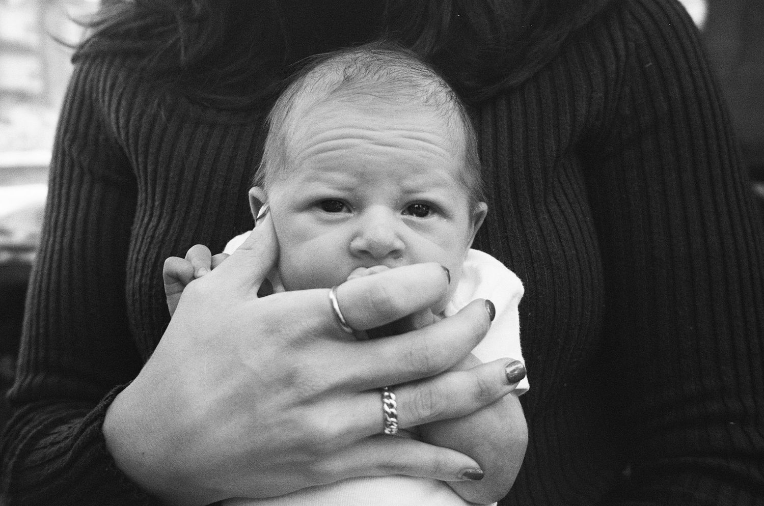 lifestyle newborn session on 35mm film in NYC capturing quiet moments at home