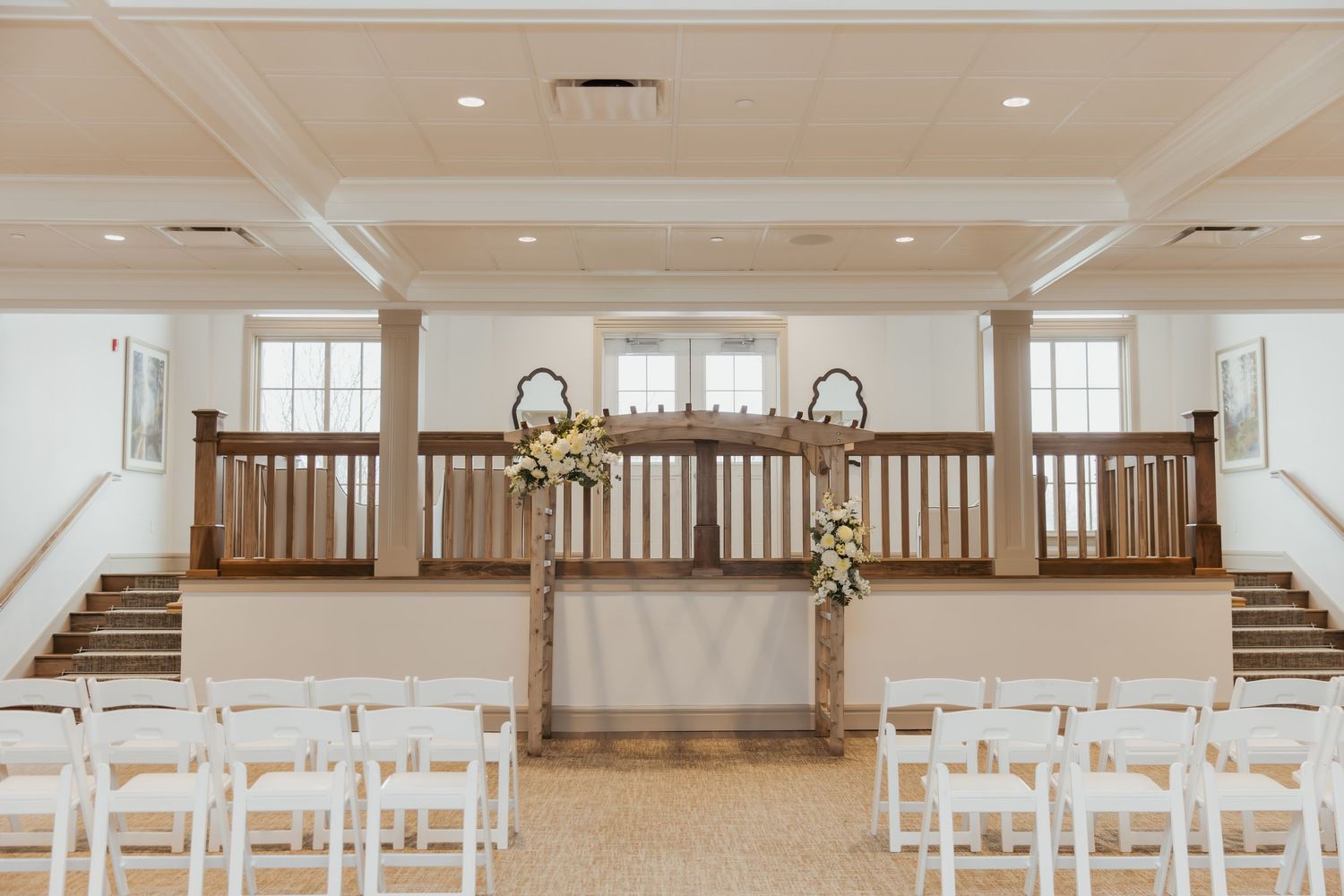 Beautiful ceremony is set up for the wedding inside holliday farms located in Zionsville, Indiana