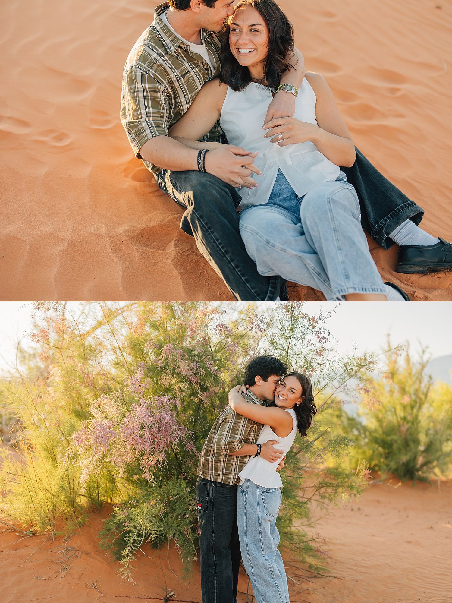 Couple sitting on red sand dunes embracing, and standing near desert shrubs in bloom during golden hour.