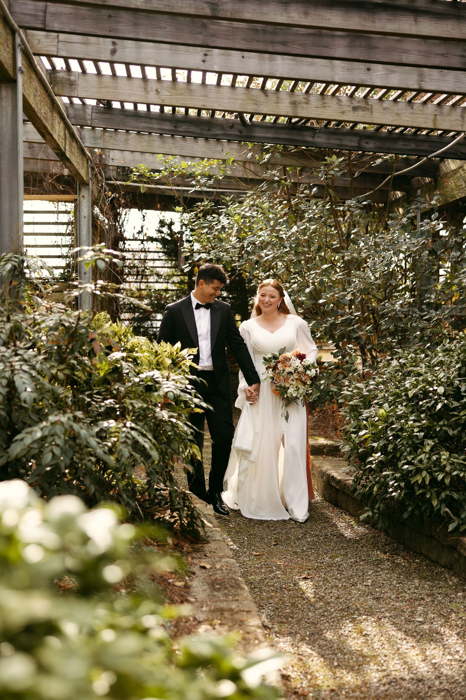 Wedding Couple hugging tightly in the gardens of JC Raulston Arboretum Photos