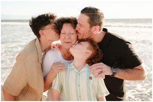 Riviera Nayarit family photographer, multigenerational beach moment, joyful candid family interaction at shoreline.