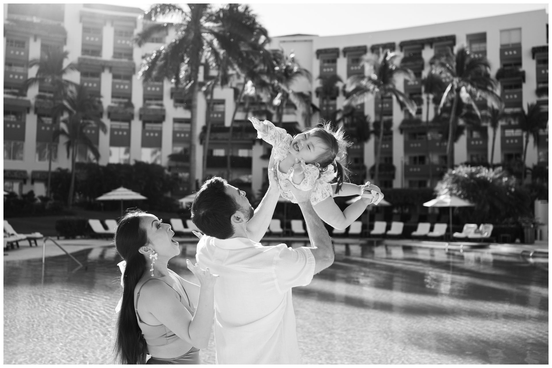Riviera Nayarit family photographer, black and white family pool session at Grand Velas with luxury resort architecture.