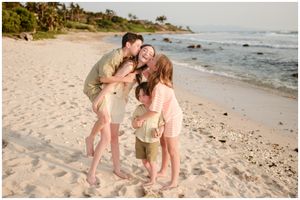 Family photos laughing and hugging on Punta Mita beach at golden hour, Punta Mita family photography session.