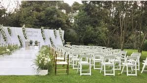 luxury garden wedding venue in Nairobi, captured by Nairobi Wedding Photographer, Bonnie Gichuru, showcasing lush greenery and flower arches