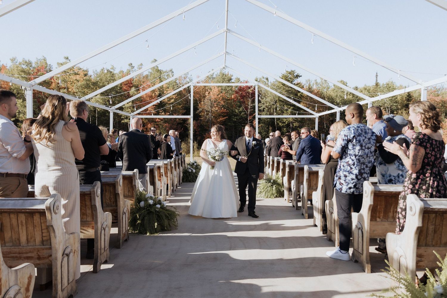bride walks down the aisle at outdoor fall wedding The Grand Ivory wedding photography Moncton New Brunswick classic portraits