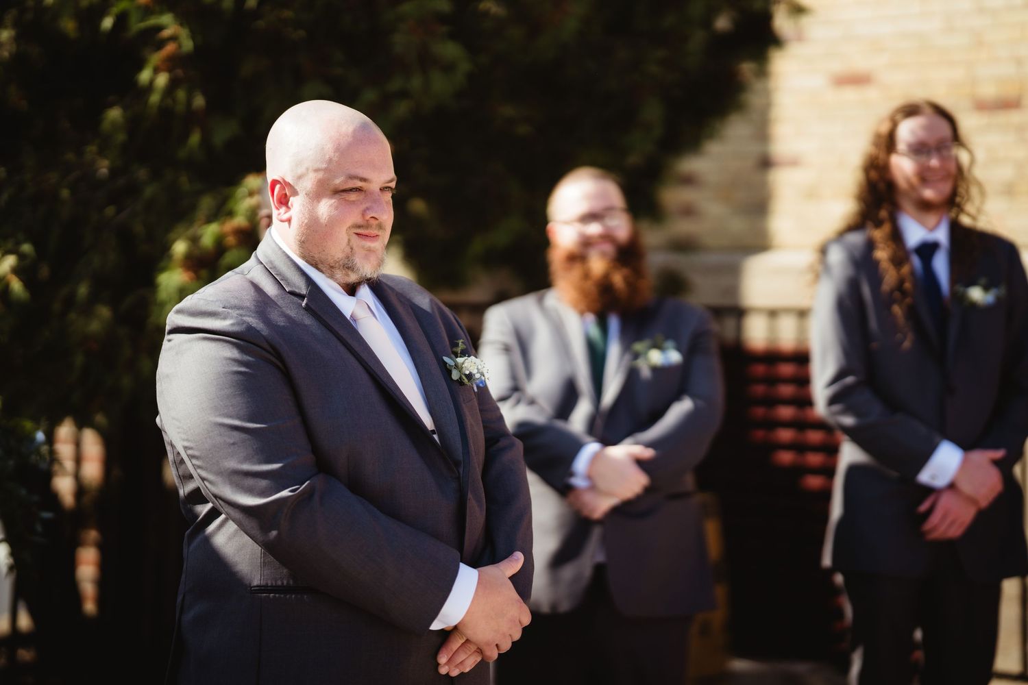A series of five photos showing groomsmen laughing and smiling together during a wedding photo session outdoors.