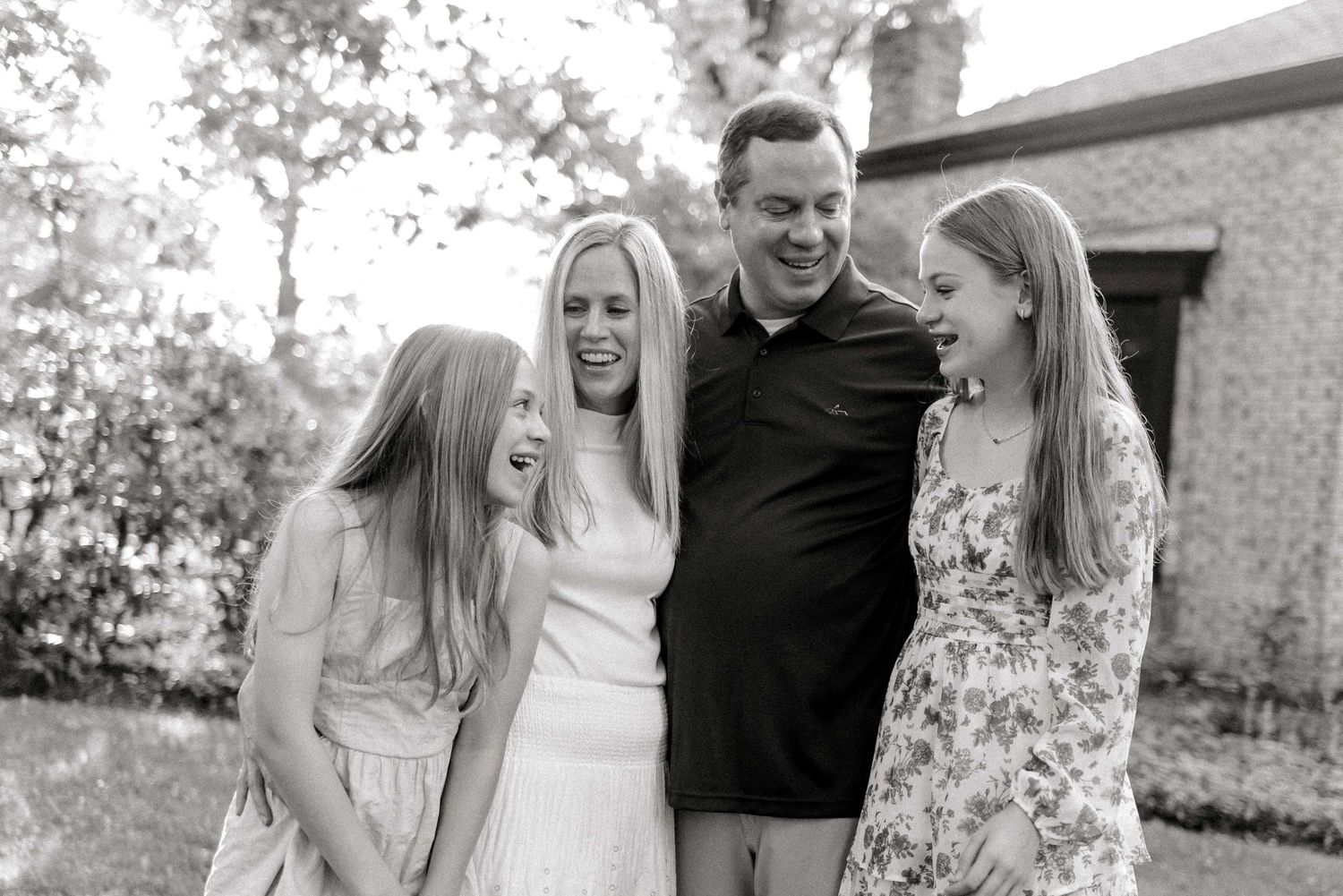 Kids and parents laughing in black and white in Pittsburgh, PA