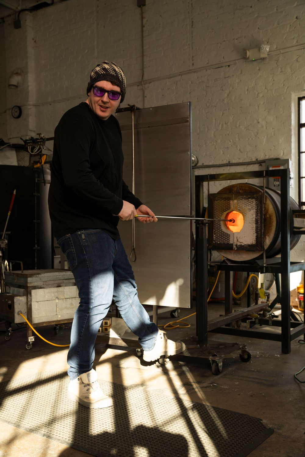 Behind-the-scenes brand photography of a Florence-based artisan in their workshop, highlighting texture and craft.
