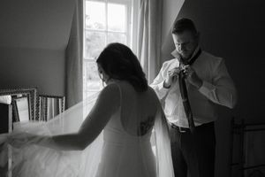 A series of black and white photos showing silhouettes of people by windows in an indoor setting.