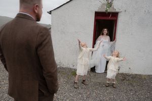 A sequence of wedding photos showing a couple posing against a white wall in rustic outdoor settings.