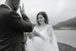 A romantic black and white wedding photo collage showing intimate moments between newlyweds by a lake.