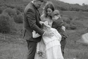 A romantic black and white wedding photo series showing tender moments between a couple in an outdoor setting.