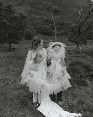 A series of black and white photographs showing people in flowing white dresses dancing and posing in a natural outdoor setting.