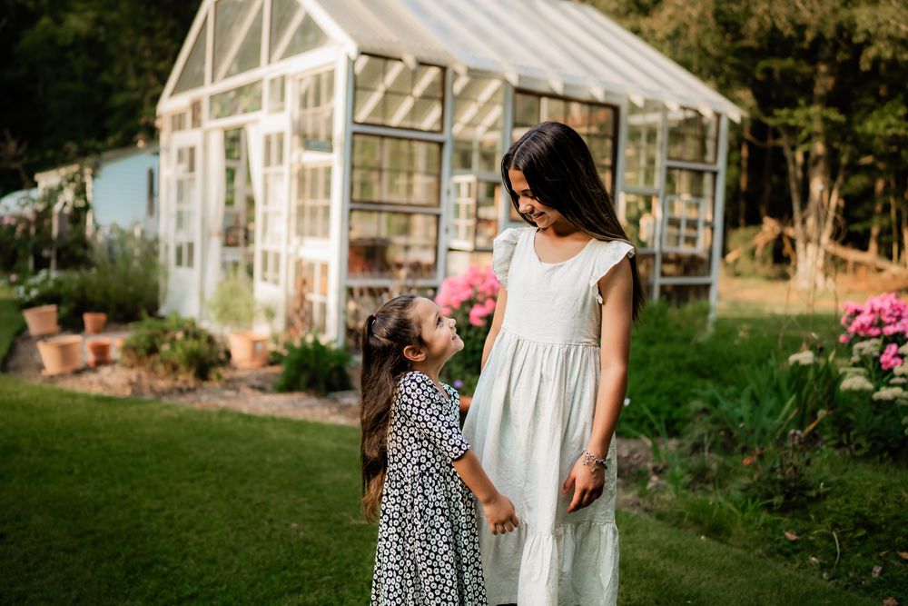 A collection of outdoor garden scenes showing a greenhouse and blooming flowers in a lush backyard setting.