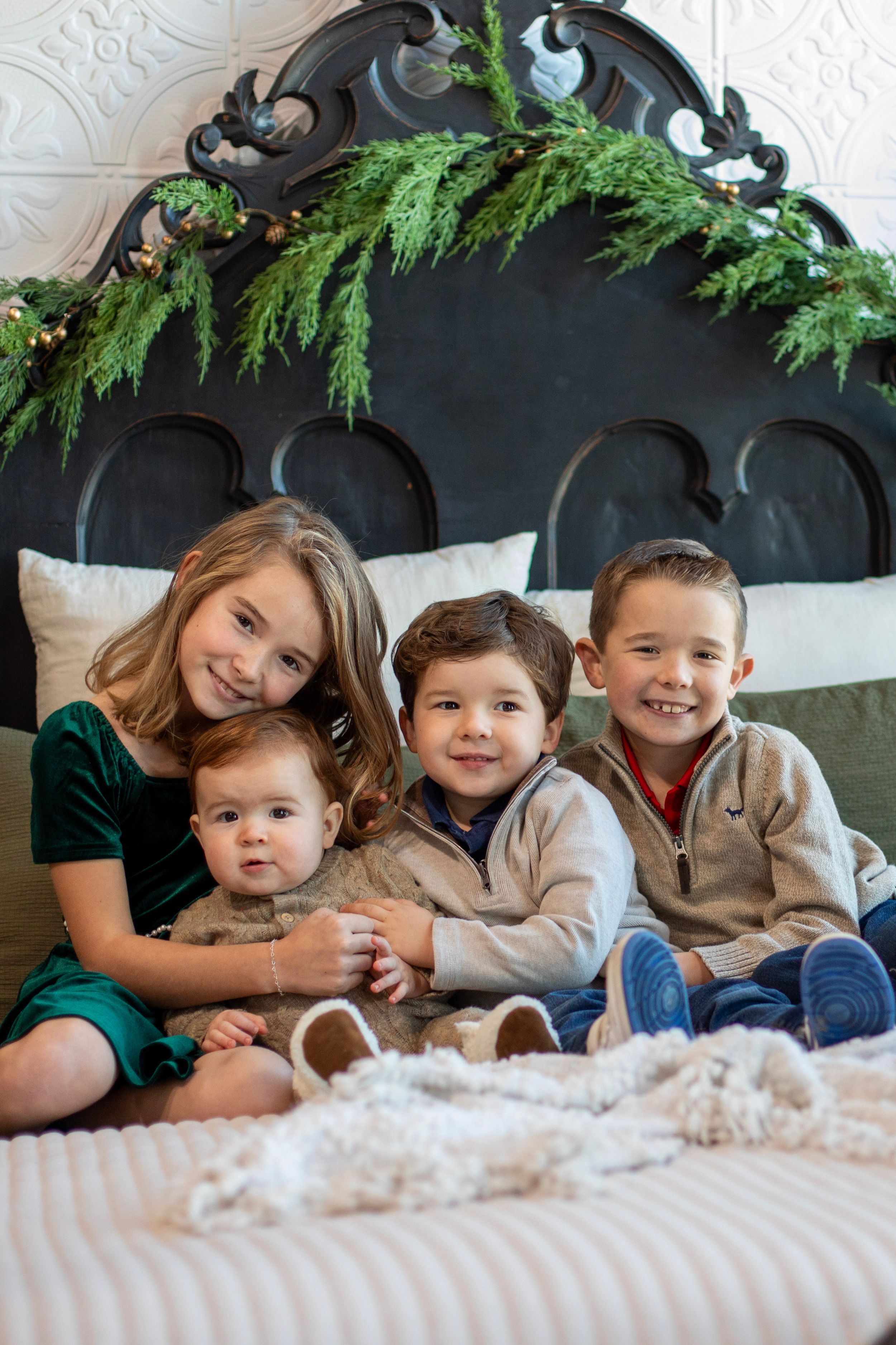 Middletown studio Christmas siblings portraits with seasonal props and festive outfits.