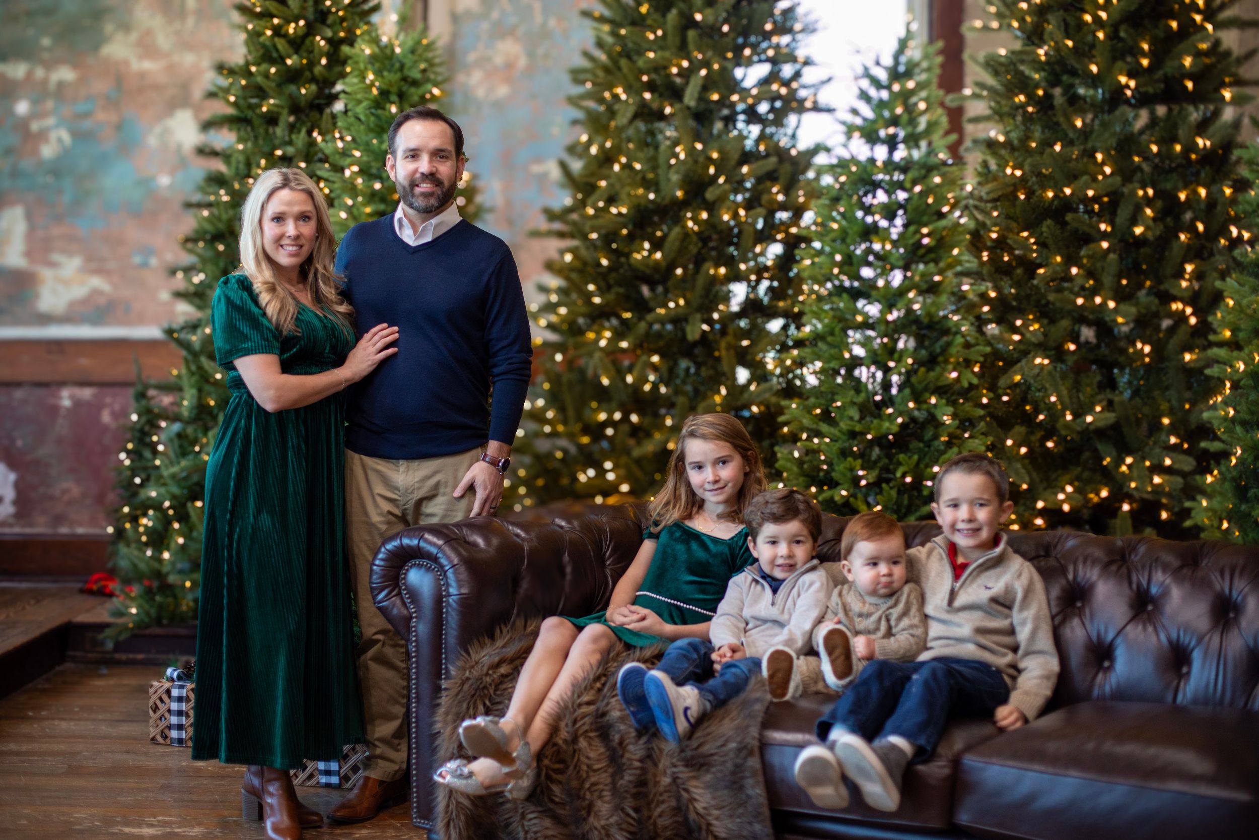 Cincinnati studio Christmas mini session large family portraits with festive holiday backdrop and professional photography.