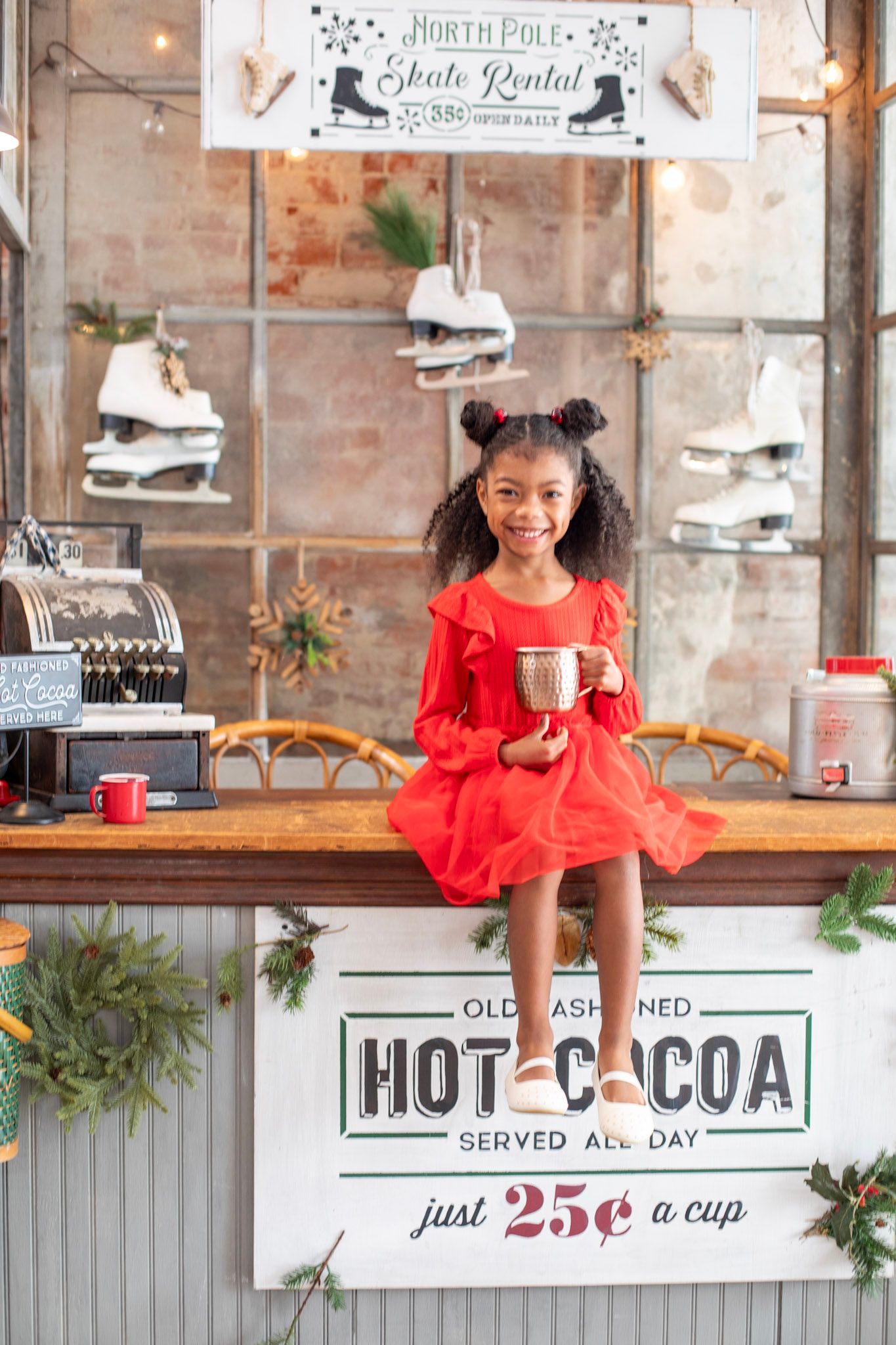 Cincinnati professional studio Christmas mini session capturing families with festive holiday setup, cozy décor, and joyful seasonal portrai