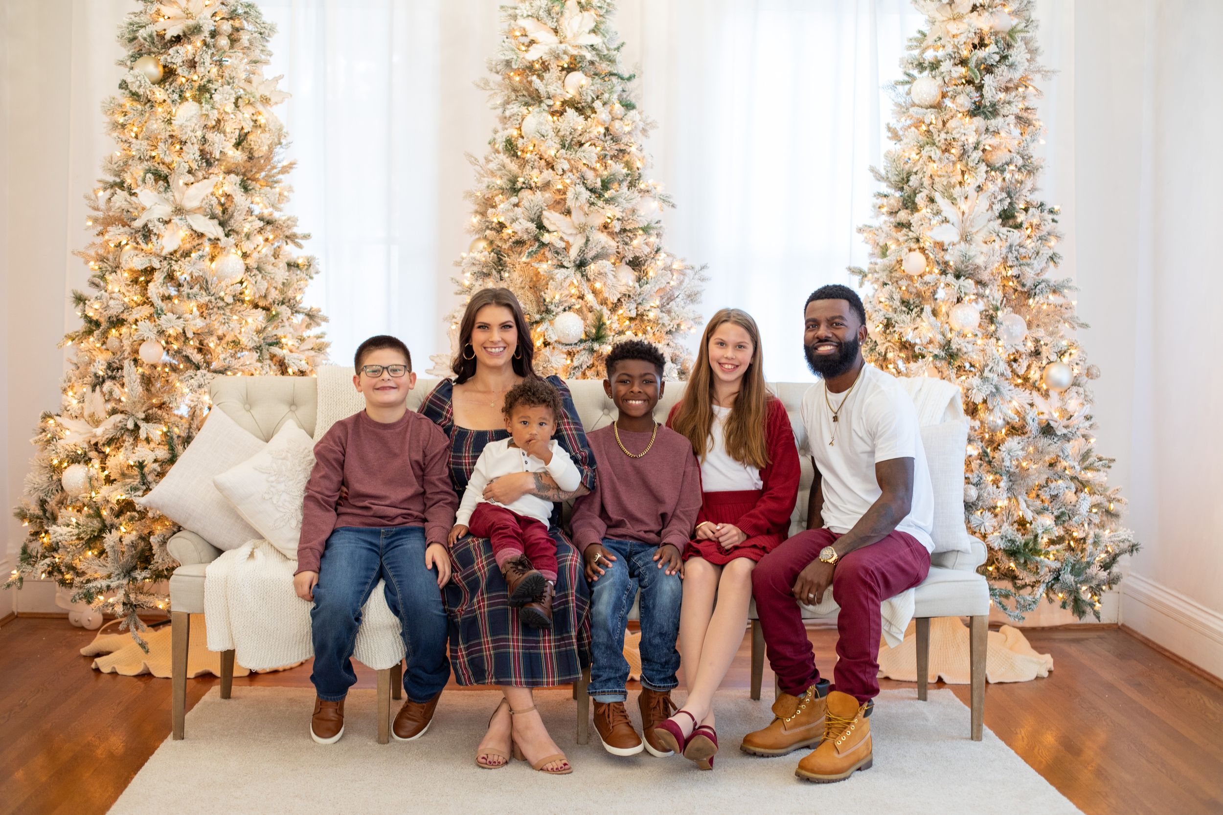 Cincinnati studio Christmas mini session large family portraits with festive holiday backdrop and professional photography.