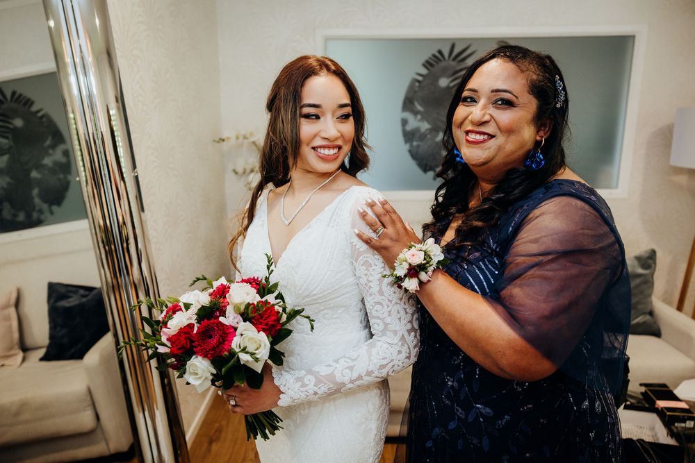 Wedding celebration scene showing joyful moments in an indoor setting with elegant decor.