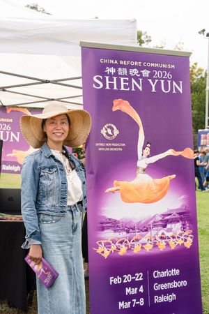 Promotional banners for Shen Yun performing arts show featuring colorful dancers and performance dates in purple.