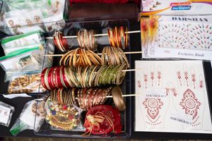 Display of traditional Latin American snacks and treats arranged in decorative boxes.