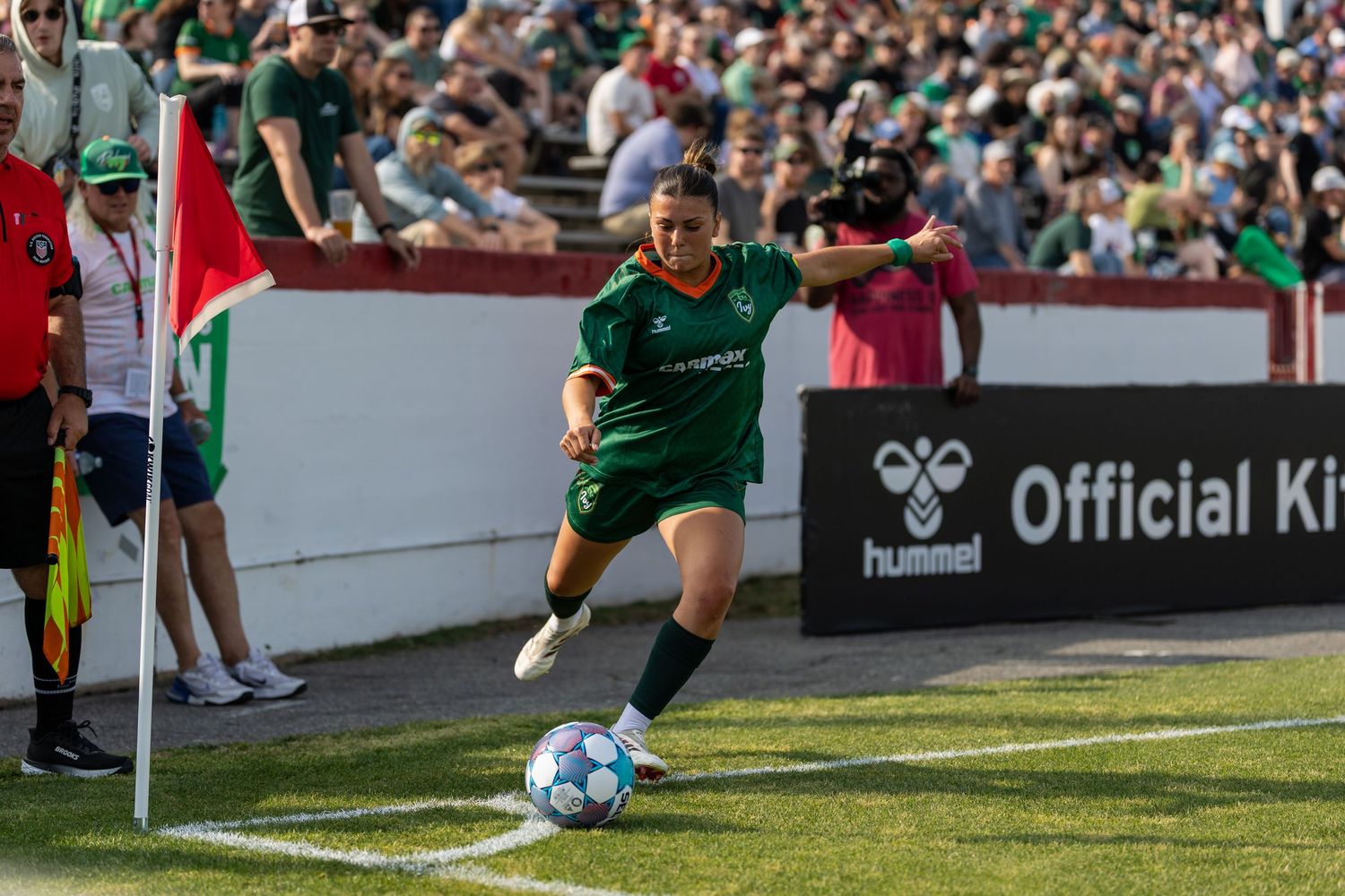 Soccer players in red and white uniforms competing intensely during a match.