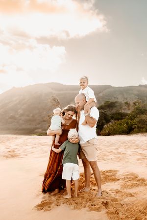 Oahu Family Photographer captures a family at sunset in Hawaii.