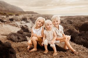 Oahu Family Photographer captures a family at sunset in Hawaii.