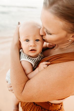 Oahu Family Photographer captures a family at sunset in Hawaii.