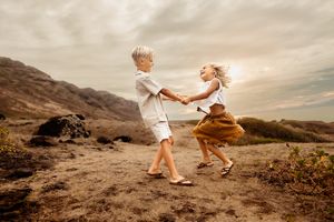 Oahu Family Photographer captures a family at sunset in Hawaii.