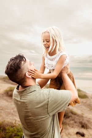 Oahu Family Photographer captures a family at sunset in Hawaii.