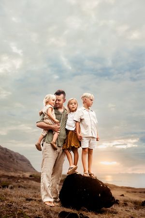Oahu Family Photographer captures a family at Kaena Point in Hawaii.