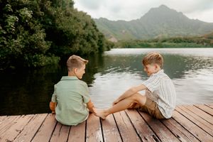 Oahu Family Photographer captures a family at Kualoa Regional Park in Hawaii.